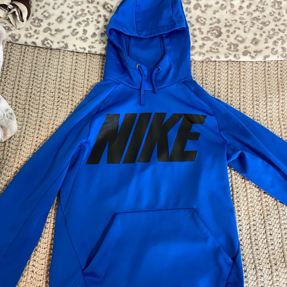 Blue Nike hoodie.